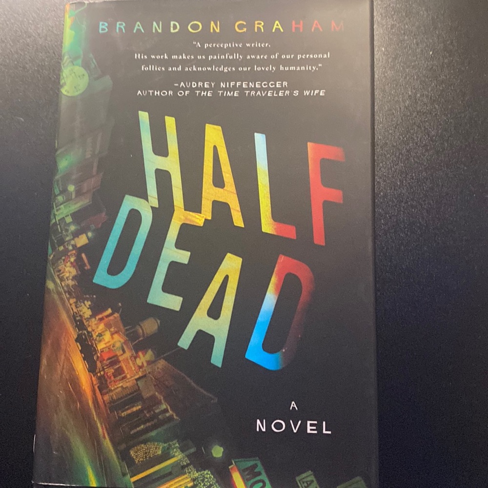 A hard cover novel called “Half Dead” written by Brandon Graham.